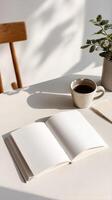 Coffee and an Open Notebook on a Wooden Table in a Bright Space During Morning Hours. photo