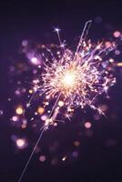 Sparkler Creating Dazzling Lights During a Nighttime Celebration in a Dark Setting photo