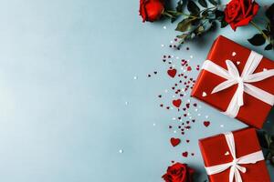 Red Gifts and Roses Arranged With Heart-Shaped Confetti for a Romantic Celebration photo