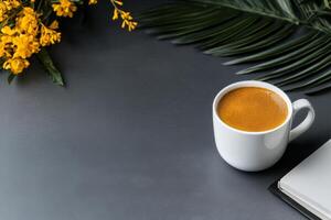 Relaxing Coffee Moment With Beautiful Flowers on a Gray Table photo