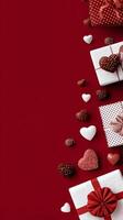 Gifts and Chocolates in Heart Shapes on Red Background for a Special Occasion Celebration or Holiday photo