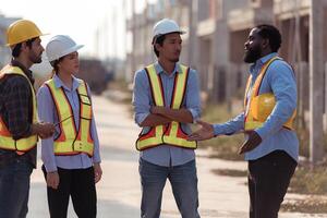 Group of architects and engineers work together to assess the residential home construction site's progress,188 photo
