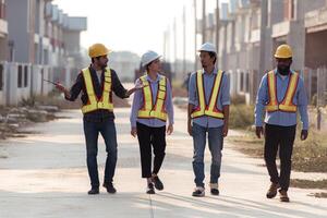 Group of architects and engineers work together to assess the residential home construction site's progress,165 photo