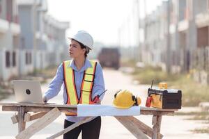 Portrait of engineers inspect and assess the residential home construction site's progress,150 photo