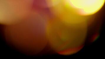Multicolored light leaks 4k footage on black background. Lens studio flare leak burst overlays. Natural lighting lamp rays bokeh effect. For compositing over your footage, stylizing , transitions video