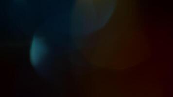 Multicolored light leaks 4k footage on black background. Lens studio flare leak burst overlays. Natural lighting lamp rays bokeh effect. For compositing over your footage, stylizing , transitions video
