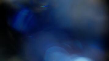 Multicolored light leaks 4k footage on black background. Lens studio flare leak burst overlays. Natural lighting lamp rays bokeh effect. For compositing over your footage, stylizing , transitions video