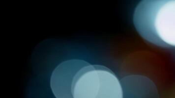 Multicolored light leaks 4k footage on black background. Lens studio flare leak burst overlays. Natural lighting lamp rays bokeh effect. For compositing over your footage, stylizing , transitions video