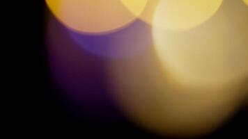 Multicolored light leaks 4k footage on black background. Lens studio flare leak burst overlays. Natural lighting lamp rays bokeh effect. For compositing over your footage, stylizing , transitions video