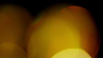 Multicolored light leaks 4k footage on black background. Lens studio flare leak burst overlays. Natural lighting lamp rays bokeh effect. For compositing over your footage, stylizing , transitions video
