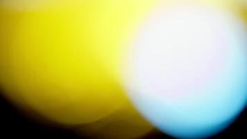 Multicolored light leaks 4k footage on black background. Lens studio flare leak burst overlays. Natural lighting lamp rays bokeh effect. For compositing over your footage, stylizing , transitions video