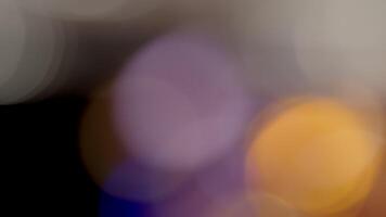 Multicolored light leaks 4k footage on black background. Lens studio flare leak burst overlays. Natural lighting lamp rays bokeh effect. For compositing over your footage, stylizing , transitions video