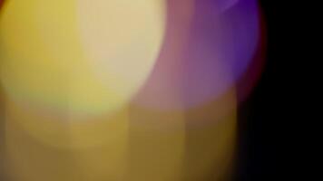 Multicolored light leaks 4k footage on black background. Lens studio flare leak burst overlays. Natural lighting lamp rays bokeh effect. For compositing over your footage, stylizing , transitions video