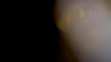 Light Leaks abstract 4K footage. Moving blinking circle lens glow flare bokeh overlays natural animation defocused blurred color background. Compositing over your footage, stylizing , transitions video