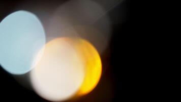 Multicolored light leaks 4k footage on black background. Lens studio flare leak burst overlays. Natural lighting lamp rays bokeh effect. For compositing over your footage, stylizing , transitions video