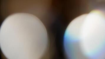 Multicolored light leaks 4k footage on black background. Lens studio flare leak burst overlays. Natural lighting lamp rays bokeh effect. For compositing over your footage, stylizing , transitions video