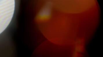 Multicolored light leaks 4k footage on black background. Lens studio flare leak burst overlays. Natural lighting lamp rays bokeh effect. For compositing over your footage, stylizing , transitions video
