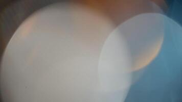 Light Leaks abstract 4K footage. Moving blinking circle lens glow flare bokeh overlays natural animation defocused blurred color background. Compositing over your footage, stylizing , transitions video