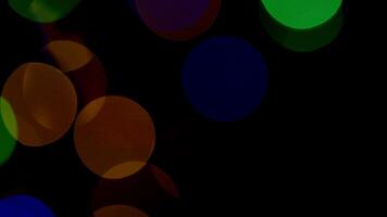 Multicolored light leaks 4k footage on black background. Lens studio flare leak burst overlays. Natural lighting lamp rays bokeh effect. For compositing over your footage, stylizing , transitions video