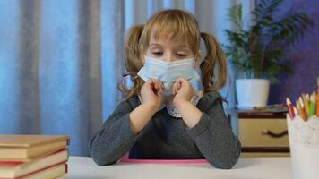 Preschool child girl distance online learning at home. Cute kid pupil studying, looking at camera. Children remote e-learning study homework education on covid-19 quarantine. Slow motion, 6k downscale video