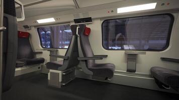 Modern first-class cabin of a Swiss double-decker train offers spacious, clean, and comfortable seating with large windows for scenic views, ideal for a relaxing and efficient European rail journey. video