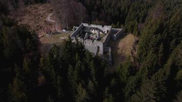 Drone footage of Fort Claudia in Tyrol, Austria, part of Ehrenberg fortification system. This high-angle view reveals ancient stone walls, mountain defense structures and Austrian Alps scenery. video