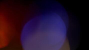 Multicolored light leaks 4k footage on black background. Lens studio flare leak burst overlays. Natural lighting lamp rays bokeh effect. For compositing over your footage, stylizing , transitions video