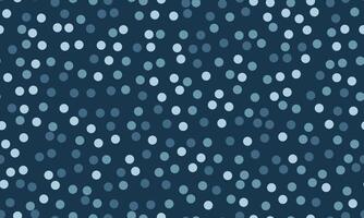 Abstract seamless pattern of scattered dots in varying shades of blue on a dark blue background. vector
