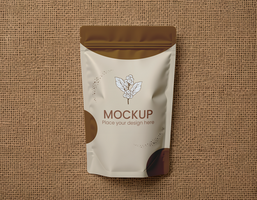 Mockup of a stand-up pouch on a textured surface for product presentation psd