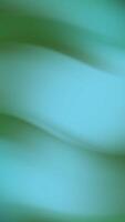 Blurred teal and green abstract waves ideal for background designs, website headers, and artistic projects that need a soft, serene touch. video