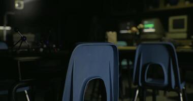 CGI Students engage in a science lab activity in a dimly lit classroom space video