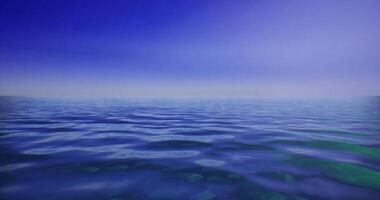 CGI Vast calm ocean under a tranquil blue sky with soft waves video