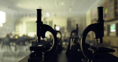 CGI Close up of microscopes in a school classroom during a science lesson video