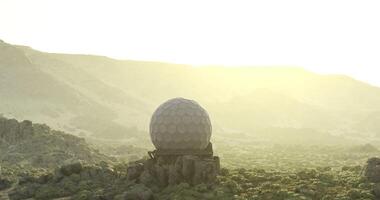 CGI Unique geodesic dome on rocky landscape at sunrise in desert video