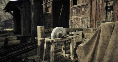 CGI Old wooden structure with a stone wheel in a rustic setting video