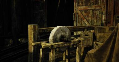 CGI Rustic wooden wheel on a stand in a dimly lit workshop setting video