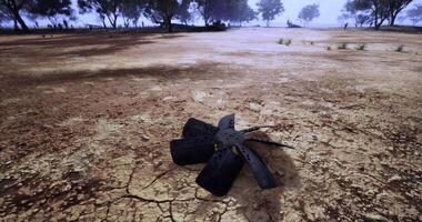 CGI A weathered propeller lies on dry, cracked ground in an abandoned outdoor area video