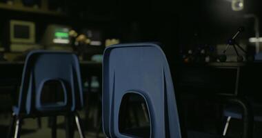 CGI Empty classroom with blue chairs and dim lighting in a learning space video