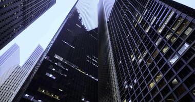 CGI Skyward view of towering skyscrapers in a bustling urban area at dawn video