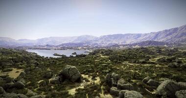 CGI Expansive landscape view with a serene lake surrounded by mountains video