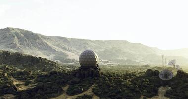 CGI Exploring a futuristic research facility in a vast, arid landscape at dawn video