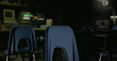 CGI Quiet classroom with empty chairs and dim lighting in an educational setting video