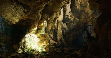 CGI Mysterious underground cave illuminated by natural light in rocky landscape video