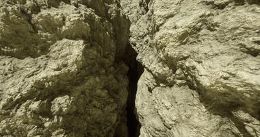 CGI Crack between large rock formations in a natural landscape during daylight video