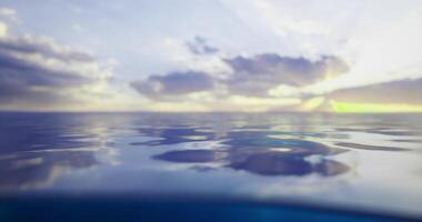 CGI Calm water reflecting clouds during sunset at a serene coastal location video