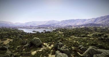CGI Breathtaking landscape showcasing a serene lake surrounded by rocky hills video