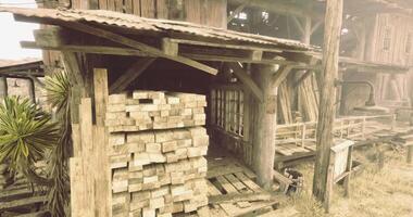 CGI Rustic wooden structure with stacked lumber in a dusty environment video