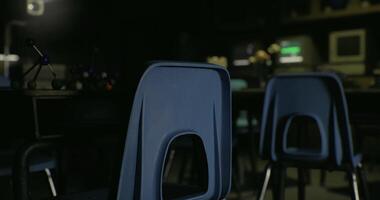 CGI Empty classroom with blue chairs and dim lighting at twilight video