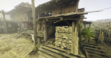 CGI Old wooden structure with stacked lumber in a desert setting video