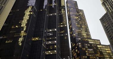 CGI Modern skyscrapers reflecting urban life in a bustling cityscape video